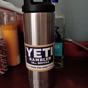 Yeti Stainless Steel Rambler Bottle with Black Lid and Blue Label Accents